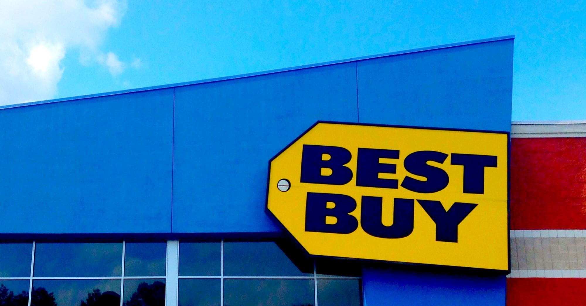 Yellow Best Buy sign on a blue building.
