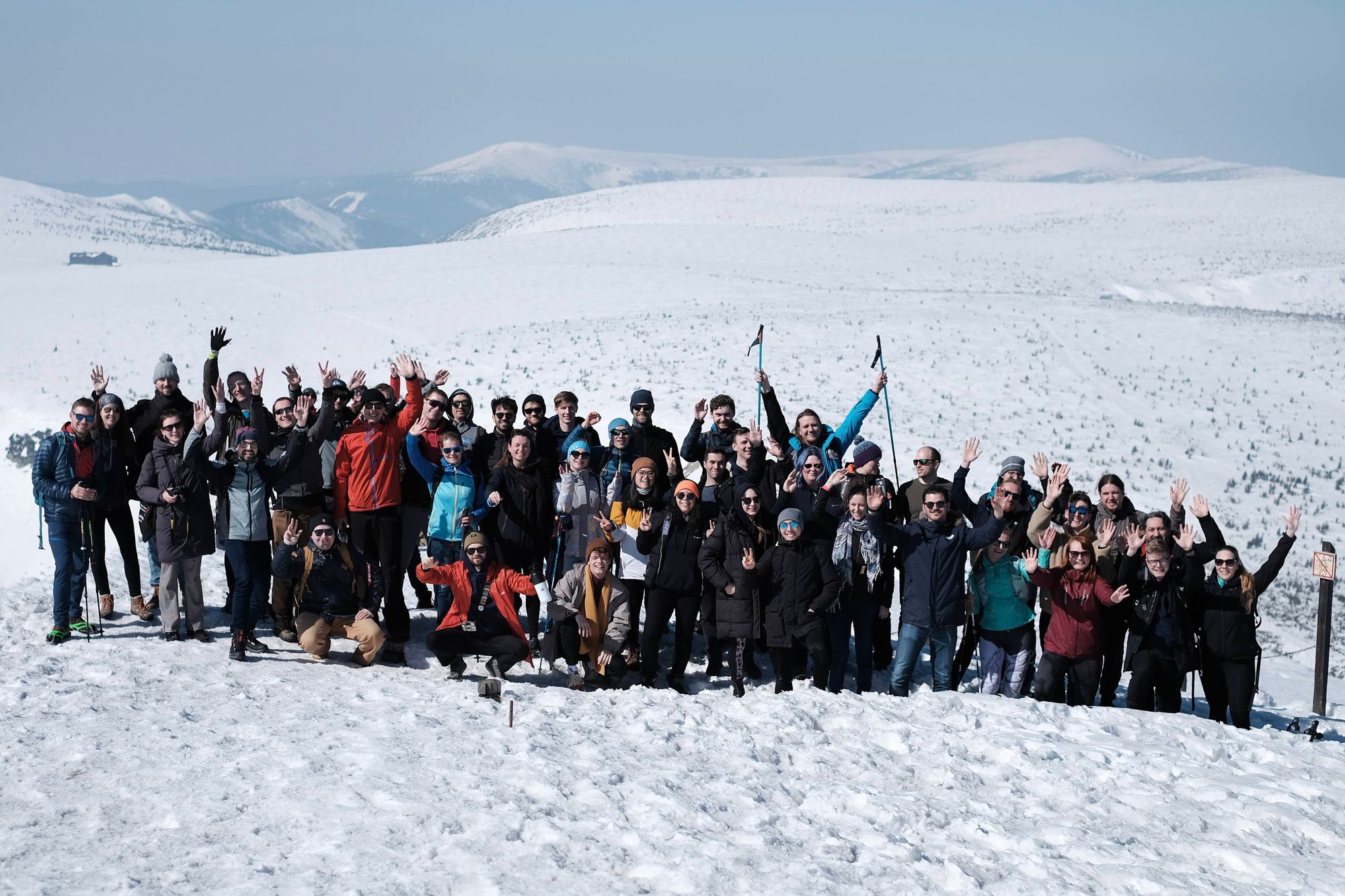 Group photo in the snow of the Apifiers who made it to the top of Sněžka.