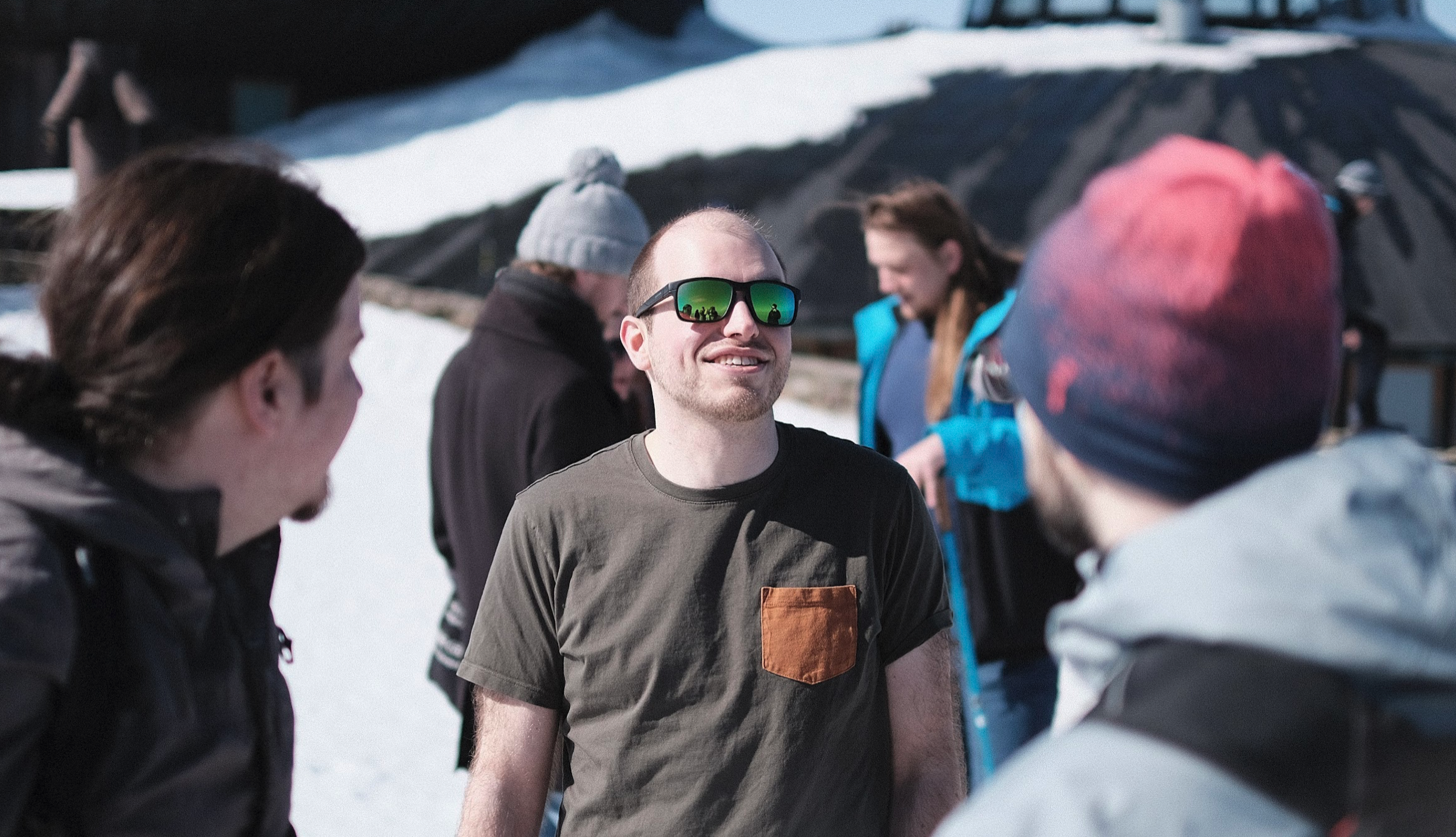 Gabin in short sleeves standing with other Apifiers on Sněžka.