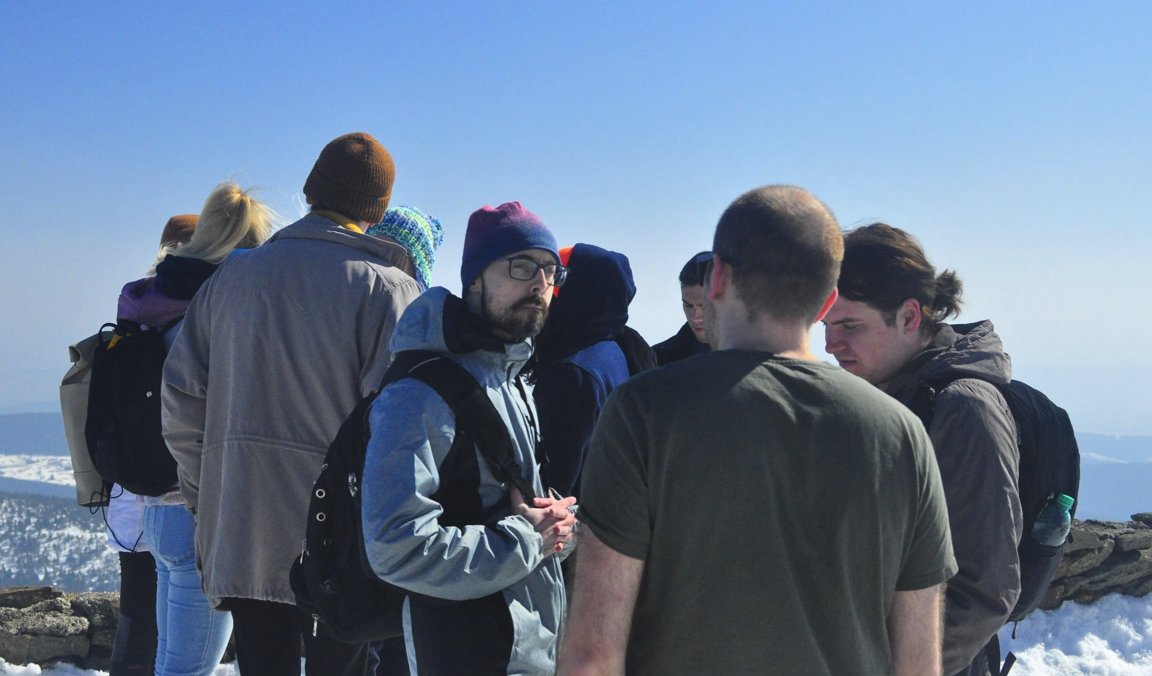 Paulo from Brazil standing with a group of Apifiers in Sněžka.