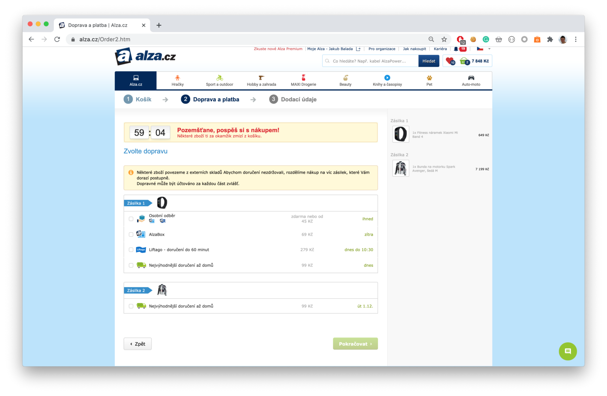 screenshot of a shopping cart on alza.cz, with products divided into two orders