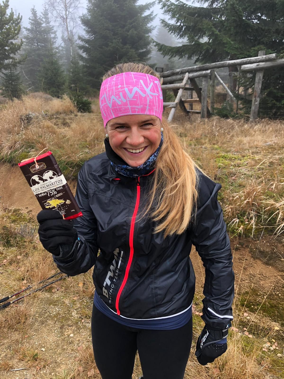 A Person holding a chocolate bar.