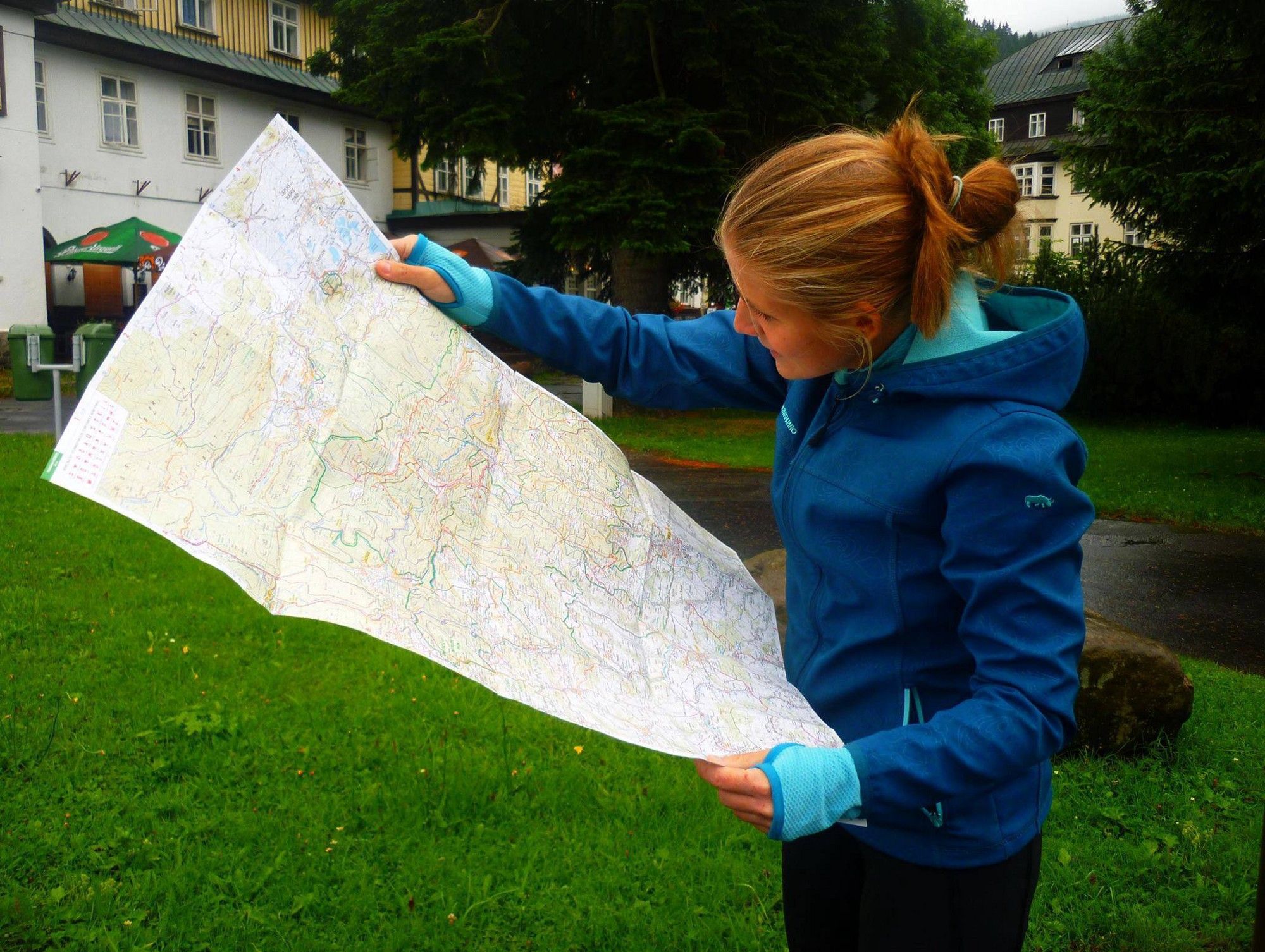 Person looking at a paper map.