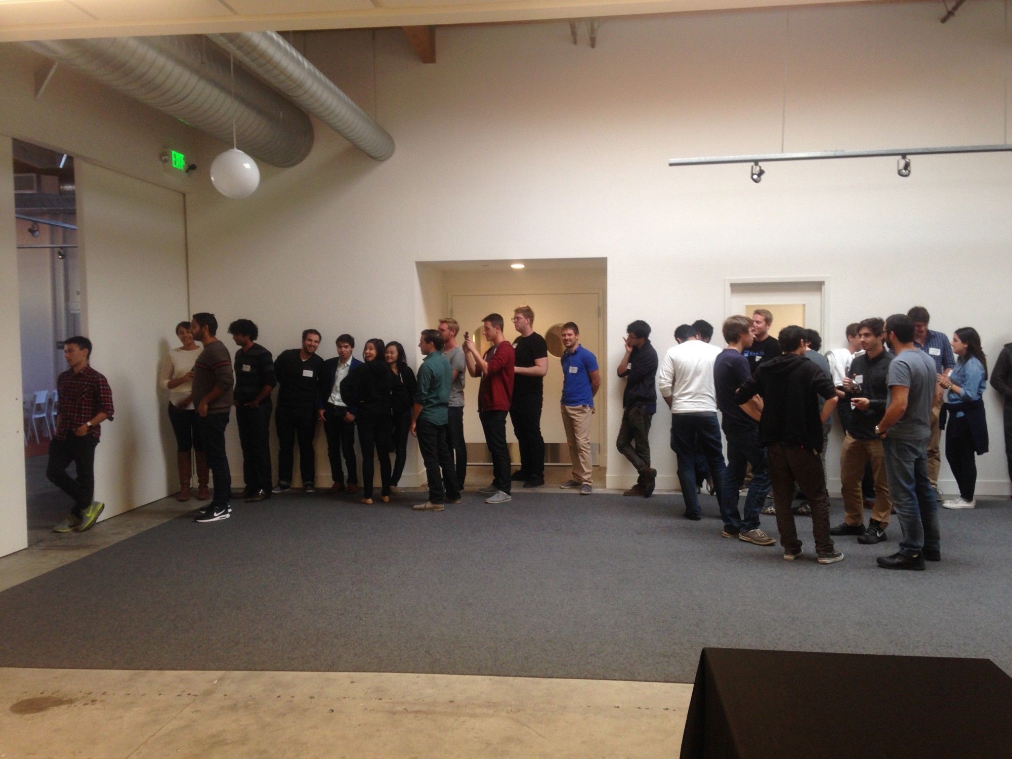 Photo of YCF demo day, with people queuing for 150 seconds of demo time