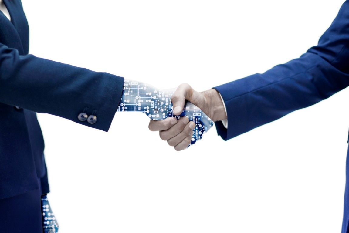 AI in marketing: navigating the future of digital marketing. Photo of person in suit shaking hands with digital AI