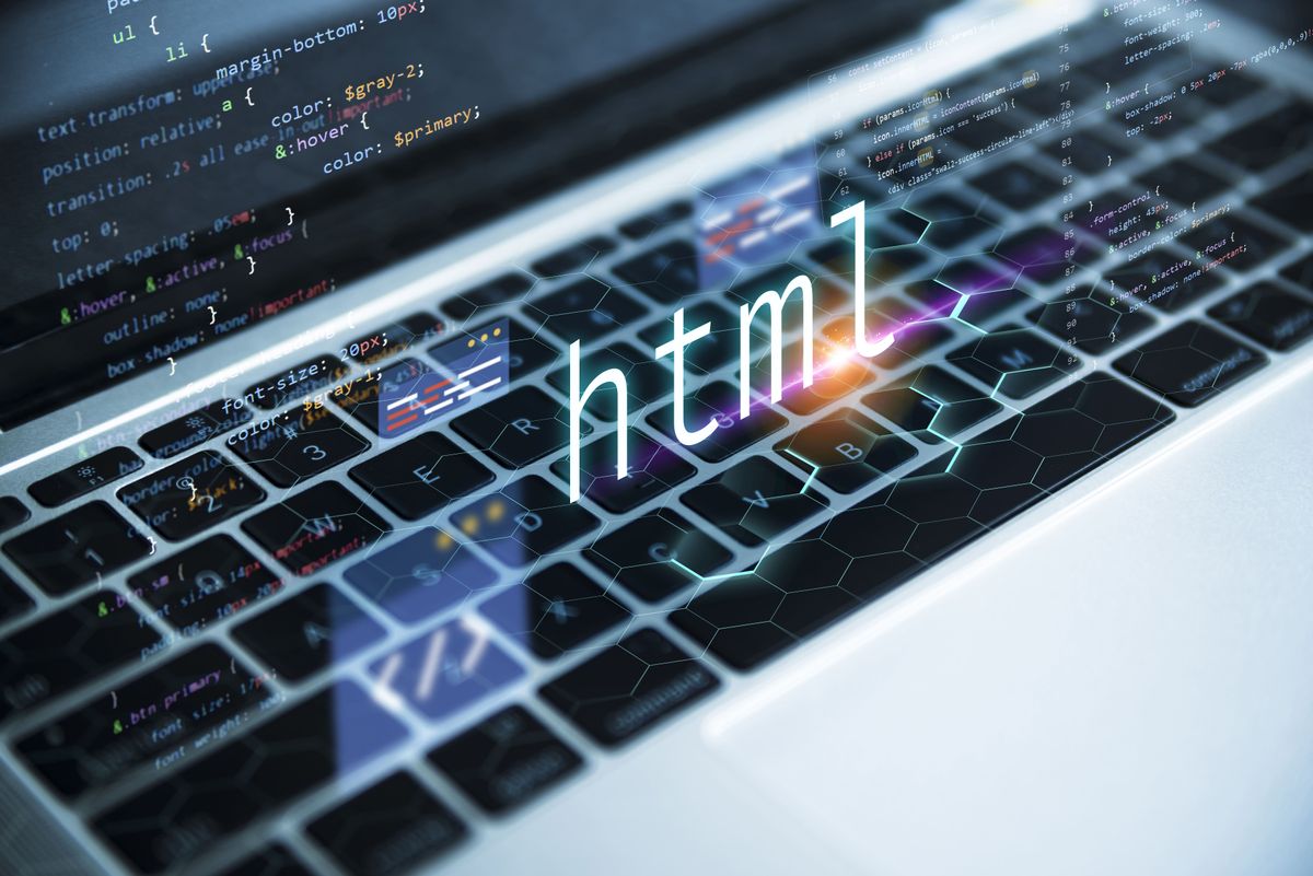 How to parse HTML in Python with PyQuery or Beautiful Soup: html letters floating over laptop keyboard